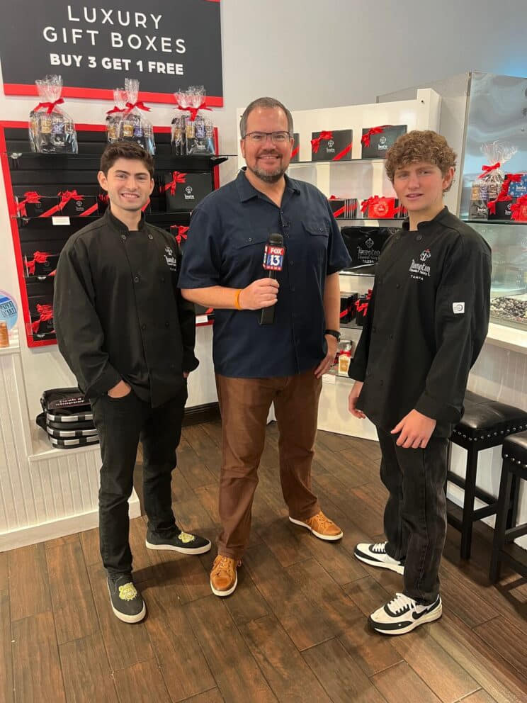 Founders of Hampton Chocolate Factory Austin and Grant Gappelberg with Charley Belcher of Fox 13