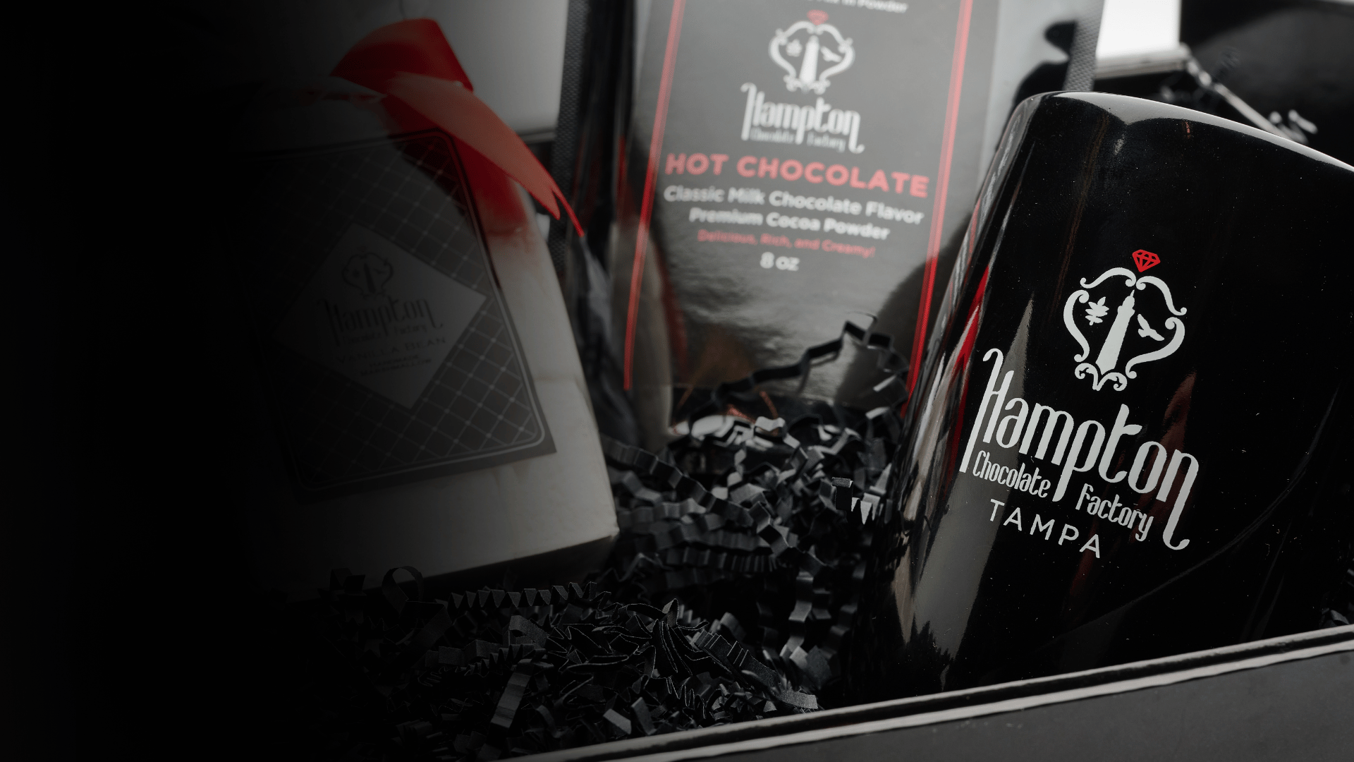 Seasonal artisan chocolate gift boxes from Hampton Chocolate Factory displayed with festive packaging and handcrafted sweets